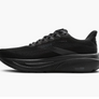 Side view of a black running shoes against a white background