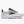 White, black and rose gold running shoes on a white background