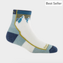 A sock that is light blue, navy blue and has yellow accents with a white mountain on the front of the sock.