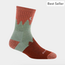 A sock that is burnt orange with a burnt orange and sage green layered tree line against a white background.