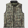 Woodland camo puffer vest against a white background.