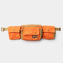 Orange waist bag with 3 large pockets against a white background.