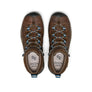 Top view of a pair of brown and black shoes that have blue accents against a white background.