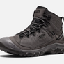 Side view of a grey shoe with black accents with the Keen logo on the side and on the tongue of the shoe against a white background.