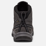 Back view of a shoe that is grey with black accents against a white background.