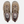 Top view of a pair of tan shoes that have purple accents against a white background.