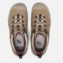 Top view of a pair of tan shoes that have purple accents against a white background.