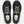 Top view of a pair of black shoes with white laces and green accent on the tongue against a white background.