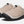 Pair of tan shoes that are fuzzy on the outside with black rubber soles and a draw string on top against a white background.