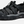 Angled side view of a black sandal with grey accents and the Keen logo on the side against a white background.