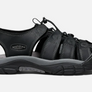 Side view of a black sandal with grey accents and a Keen logo on the side against a white background.