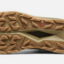 Sole of a shoes that is tan and has the Keen logo in the middle.