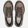 Top view of a pair of light brown and dark brown shoes with black laces against a a 
white background.