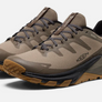 Brown pair of shoes that have dark brown, black and olive accents with the Keen logo on the side.