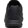 Back view of the heel of a black shoe against a white background. 
