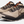 A Pair of tan shoes with varying shades of brown and orange accents that has a large light brown K on the side of the shoe.