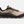 Side view of a tan shoe that has dark brown and burnt orange accents and a let letter K in a light brown color on the side of the shoe.