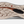 Light tan colored shoe sole with black and orange accents on the bottom and the Keen logo in the middle.