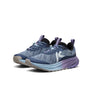 Pair of blue running shoes with purple accents on a white background