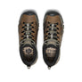 Top view of a pair of shoes that are brown, dark green, and black with bungee cord shoe laces against a white background