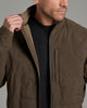 Person holding the collar of a brown jacket.