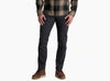 Person wearing dark grey pants and a flannel against a white background.