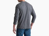 Back view of a person wearing a long sleeve grey shirt with blue jeans against a white background.