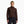 Person wearing a dark brown sweater against a white background.