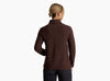 Person wearing a dark brown sweater against a white background.