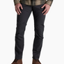 Person wearing dark grey pants with a flannel and brown boots against a white background.