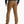 Back view of a person wearing a pair of tan pants with a dark grey shirt and brown shoes against a white background.