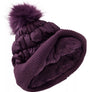 Dark purple winter hat that is showing the fuzzy inside in the same color.