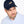 Man wearing a navy cap with a gold dog logo on a white background