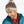 Person wearing a light colored LL Bean winter hat with a blue jacket against a white background.