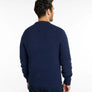 Back view of a person wearing a navy blue sweater against a white background.