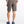 Person wearing brown shorts on a white background