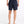 Person wearing black shorts on a white background