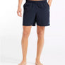 Person wearing black
 shorts on a white background