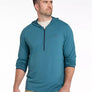Man wearing a teal long-sleeve hoodie with a zipper on a white background