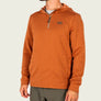 Person wearing a burnt orange hoodie that is a 1/4 zip.