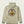 The back of a light tan sweatshirt that has a brown brand logo that covers the whole back of the sweatshirt.