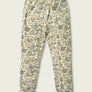 Pale colored camo sweat pants against a cream colored background.