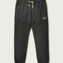 Black sweatpants with white draw strings against a white background.