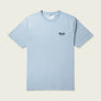 Front of a dusty blue shirt that has a brand logo for Marsh Wear on the front left pocket side of the shirt.