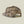 Back view of a snapback hat that is camo against a pale green background.