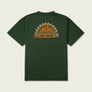 Dark green t-shirt that has Marsh Wear written inside half a saw blade that is attached to a log that says field goods against a beige background.