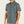 Man wearing a short sleeve light gray button up shirt with a pocket on the front
