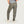 Person wearing olive green pants on a white background