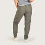 Person wearing olive green pants on a white background