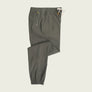Green pants on a light beige background